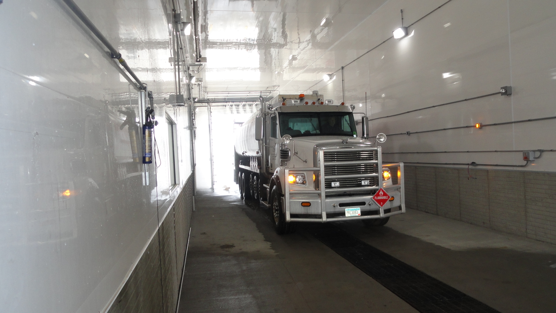 long truck inside the automated truck wash
